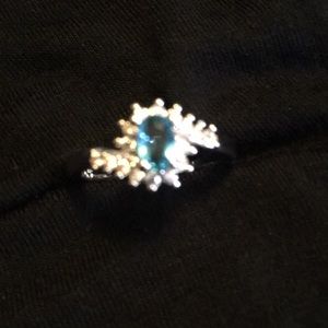 Aquamarine stone w /diamonds. Platinum plated